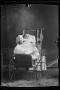 Photograph: [Baby in a wicker baby carriage]