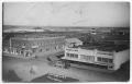 Postcard: [Aerial view of Wellington State Bank and Wellington Hotel]