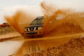 Photograph: [Truck going through muddy water]