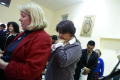 Photograph: [Prayer before town hall meeting]