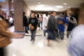 Photograph: [Students Walking Through a School Hallway]