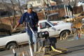 Photograph: [Man Using Large Construction Equipment]