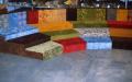 Photograph: [Colorful seating risers and shelves containing fabric rolls]