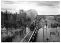Photograph: ["The Westerner" crossing the Red River Bridge]