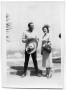 Photograph: Tito Guizar and Marie Burkhalter standing next to a sidewalk