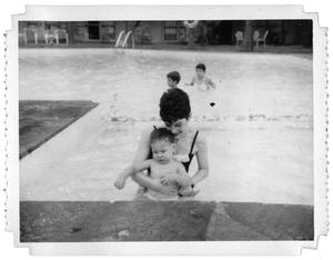 Ray Delphenis and Durk Delphenis in a pool at the Lakewood County Club