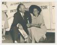 Photograph: [Man and Woman at Campaign Stop]