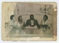 Photograph: [Group of People at a Table]