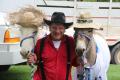 Photograph: [Photograph of Gary Stephenson, black hat, with Donkeys in white hats…
