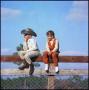 Photograph: [Two children sitting on a wooden fence]