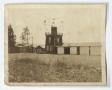 Photograph: [Two story log building with cistern]
