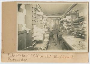 [Postmaster William Cleveland in the Palo Pinto Post Office]