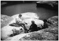 Photograph: Group Lounging by A Lake