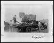 Photograph: Men Loading Cotton Gin Equip on Truck