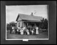 Photograph: Large Family in Front of House