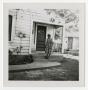 Photograph: [S. A. Winn Standing on a Porch]
