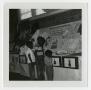 Photograph: [Children Looking at a Child Care Display]