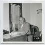 Photograph: [William G. Fuller Sitting at Desk]