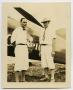 Primary view of [Two Men in Front of Airplane]