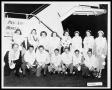 Photograph: Man with Fourteen Students in Front of Plane on Hawaii