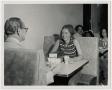 Photograph: [Photograph of Couple in Cafeteria Booth]