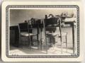 Photograph: [Tables and chairs in dormitory room at Lutheran Concordia College]