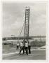Photograph: [Photograph of Firemen with Ladder]