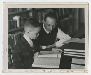 [Teacher and Student Study in a Library]