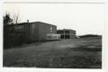 Photograph: [Two Buildings on the Side of a Hill]