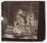 Photograph: [Young Women Standing in a Vertical Row on a Front Porch]