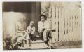 Photograph: [African American Family Sitting on Porch Steps]