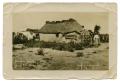 Photograph: [Photograph of People by a House]