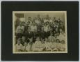 Photograph: [Group Photograph of Men and Women by a House]