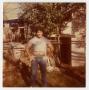 Photograph: [Photograph of a Man Standing in a Yard]