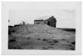 Photograph: [Barn Next to a Hill]