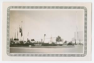 [Photograph of Texas Hall of State and Flags]