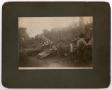 Photograph: [Men Inspecting Train Wreckage]
