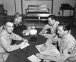 Photograph: [Military Men Seated at a Table]