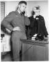 Photograph: [Man and Woman Talking on Telephones]