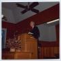 Photograph: [Photograph of Milton Greer Speaking at Podium]