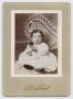Photograph: [Portrait of a Young Girl With a Doll]