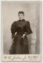 Photograph: [Portrait of a Woman Dressed in Dark Clothing]